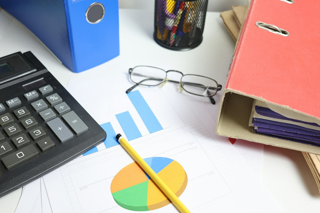 Finance desk with calculator, charts and files representing an ERP health check